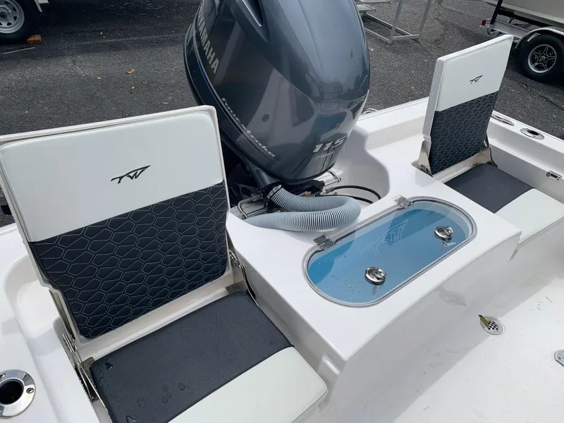 Slide: The Image of 2024 Tidewater 1910BM boat interior with Yamaha engine and seating. - 19