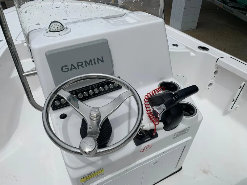 Slide: The Image of 2024 Tidewater 1910BM boat console with Garmin navigation and steering wheel. - 21
