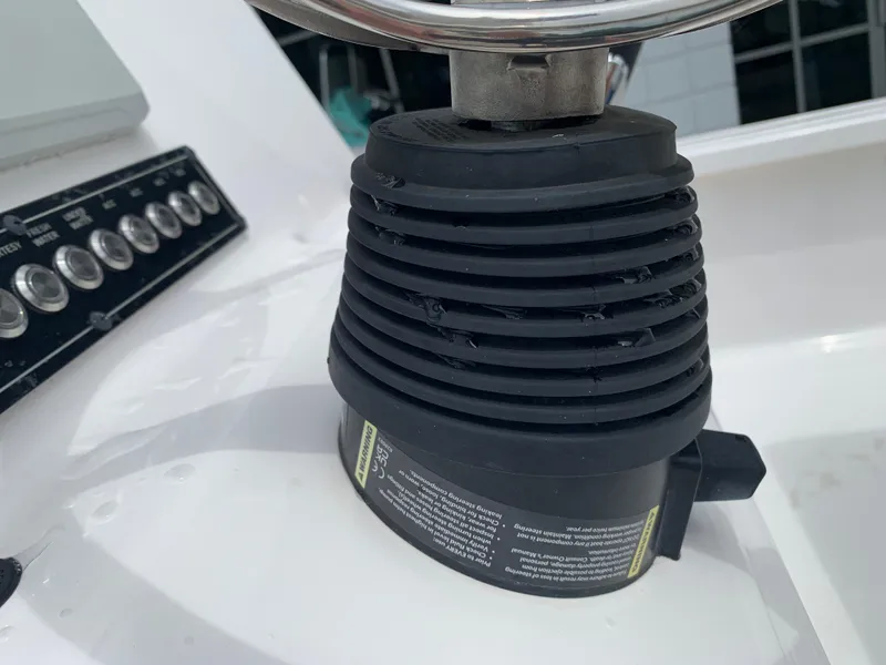 Slide: The Image of Close-up of 2024 Tidewater 1910BM boat steering mechanism and control panel. - 22