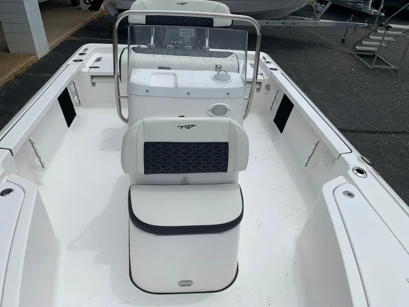 Slide: The Image of 2024 Tidewater 1910BM boat interior with seating and console, showcasing modern design. - 28