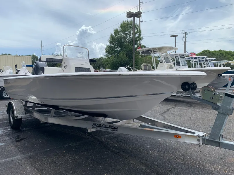 Slide: The Image of 2024 Tidewater 1910BM boat on trailer in dealership lot. - 7