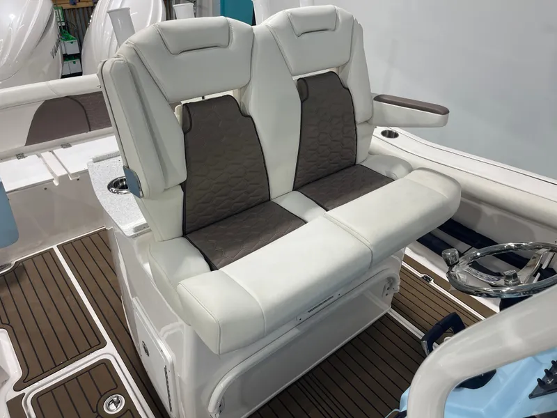 Slide: The Image of 2024 Tidewater 272LXF boat interior with luxurious seating and modern design. - 31