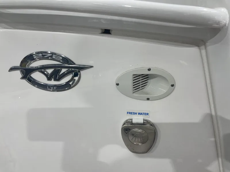 Slide: The Image of 2024 Tidewater 272LXF boat emblem and fresh water access. - 37
