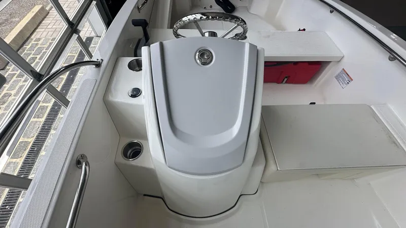 Slide: The Image of 2025 Boston Whaler 160 Super Sport interior with steering console and seating. - 14