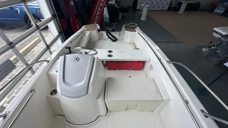 Slide: The Image of 2025 Boston Whaler 160 Super Sport interior with steering console and seating. - 16