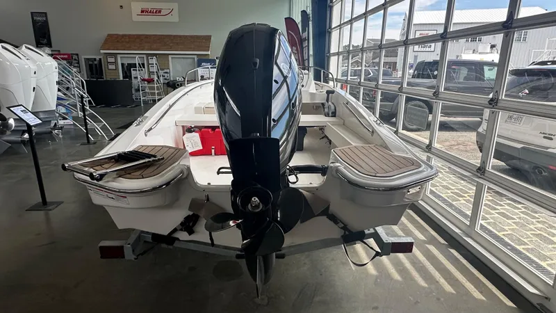 Slide: The Image of 2025 Boston Whaler 160 Super Sport boat displayed in a showroom. - 3