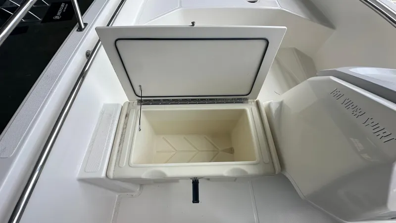 Slide: The Image of Open storage compartment on 2025 Boston Whaler 160 Super Sport boat. - 9