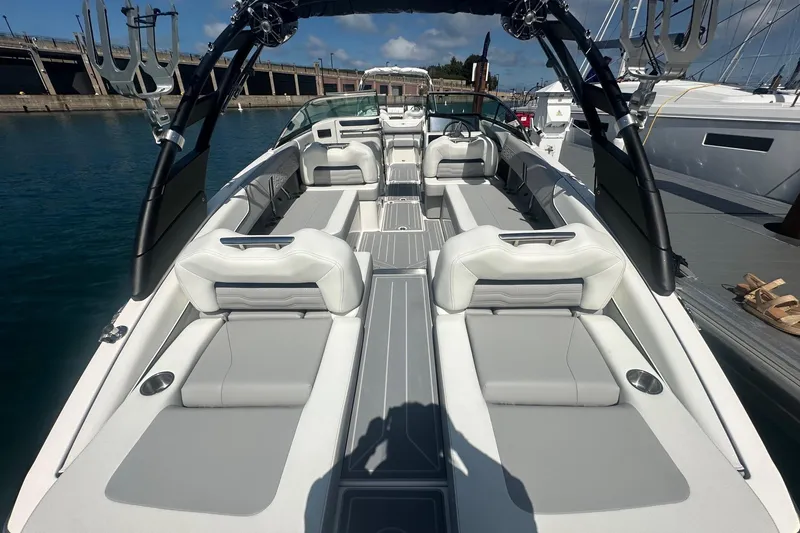 Slide: The Image of 2025 Regal LS6 Surf boat interior with sleek seating and modern design on the water. - 6