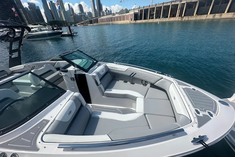 Slide: The Image of 2025 Regal LS6 Surf boat interior with sleek design and modern features at a marina. - 9