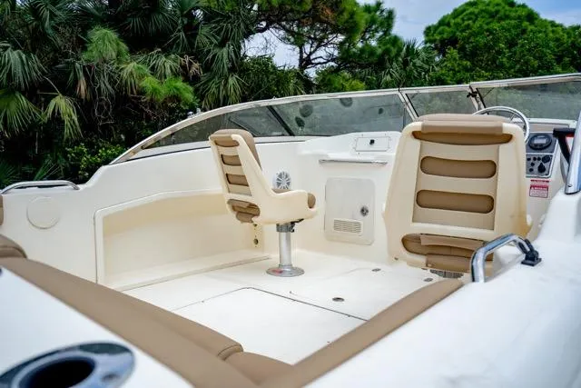 Slide: The Image of 2021 Scout 210 Dorado boat interior with beige seating and dashboard. - 10