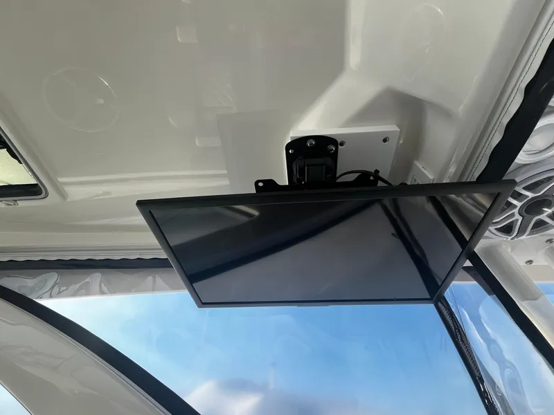 Slide: The Image of 2024 Pursuit OS 325 boat interior with mounted screen display. - 17