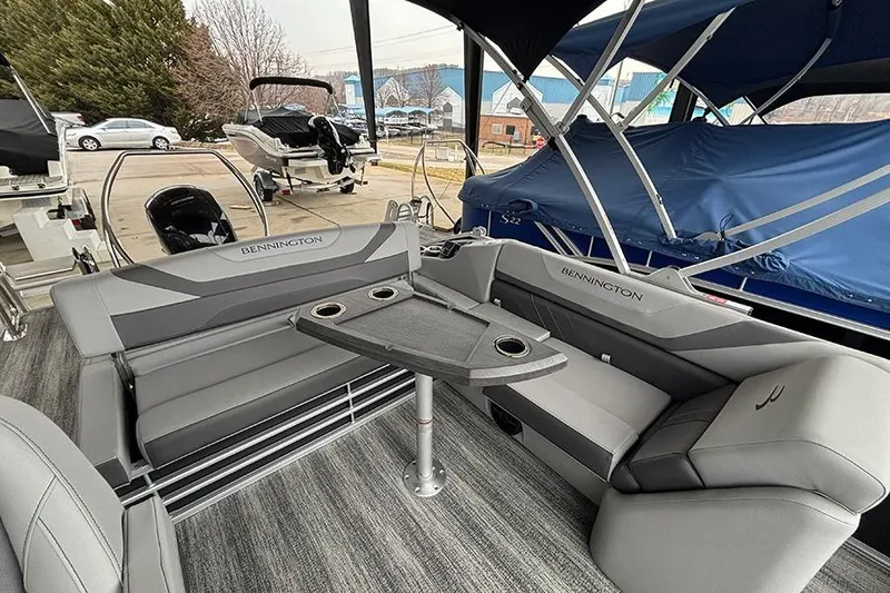 Slide: The Image of 2025 Bennington SX 22 Swingback boat interior with open storage compartment. - 14