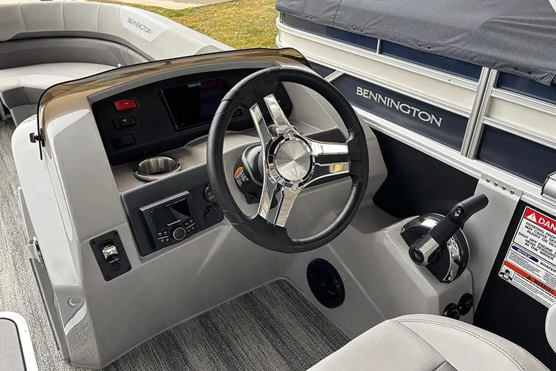 Slide: The Image of 2025 Bennington SX 22 Swingback boat interior storage compartment with cushions. - 16
