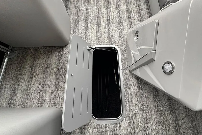 Slide: The Image of 2025 Bennington SX 22 Swingback boat interior with gray seating and modern design. - 19