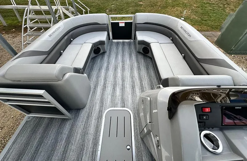 Slide: The Image of 2025 Bennington SX 22 Swingback pontoon boat interior with gray seating and flooring. - 3