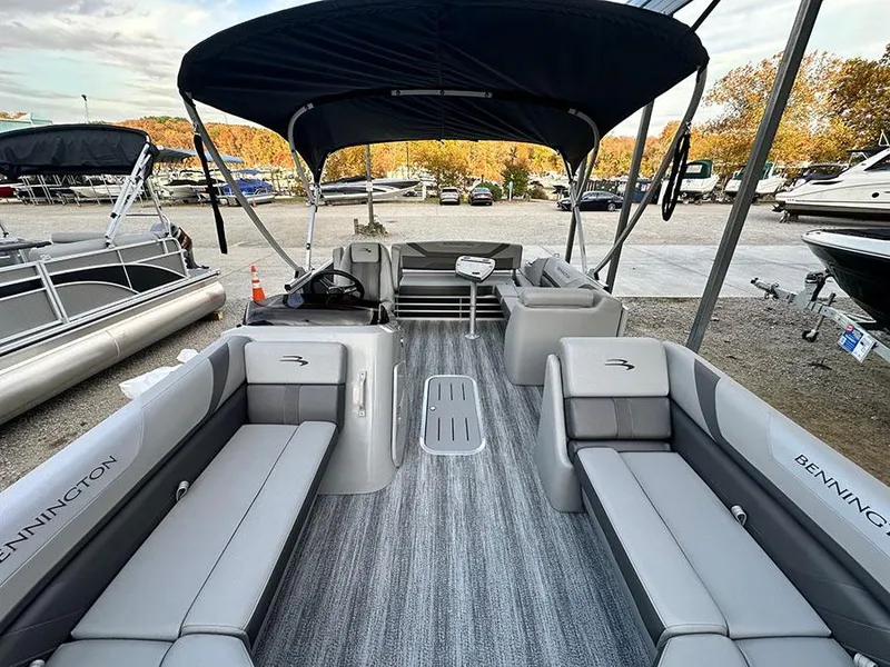 Slide: The Image of 2025 Bennington SX 22 Swingback pontoon boat with spacious seating and canopy. - 5