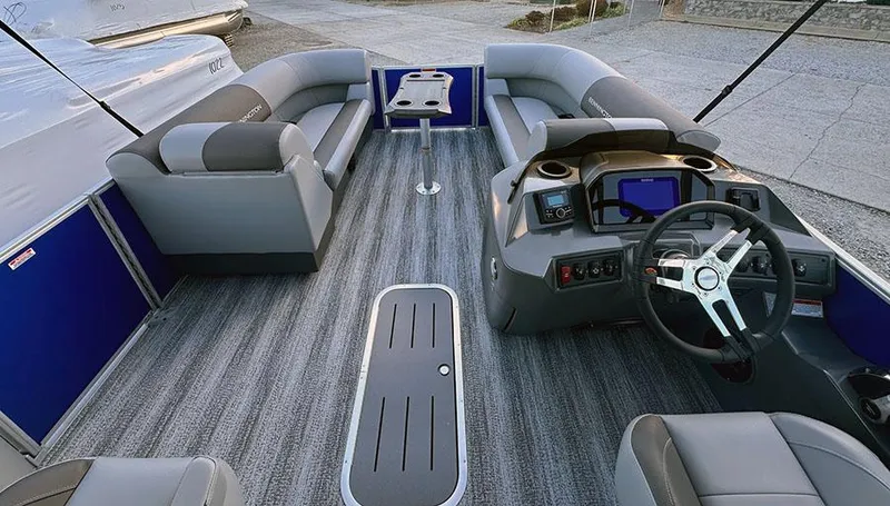 Slide: The Image of 2025 Bennington 21 S STERN RADIUS pontoon boat interior with modern seating and steering console. - 1