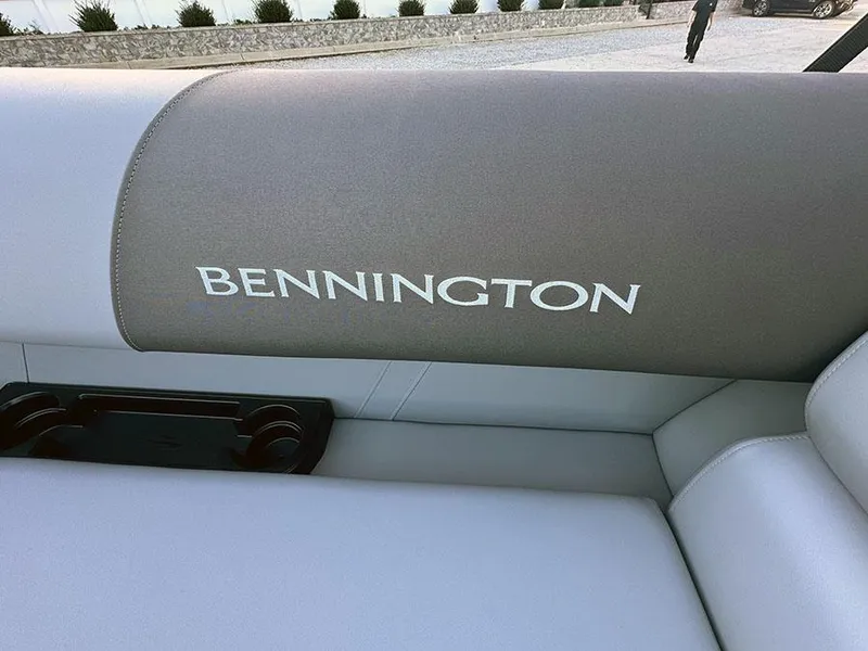 Slide: The Image of 2025 Bennington 21 S STERN RADIUS boat seat with logo and cup holders. - 10
