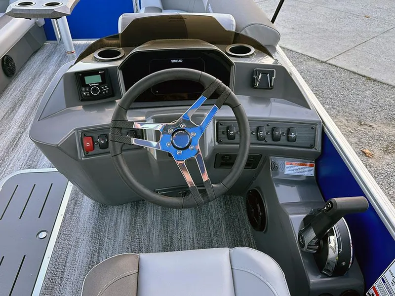 Slide: The Image of 2025 Bennington 21 S STERN RADIUS boat dashboard with steering wheel and controls. - 2