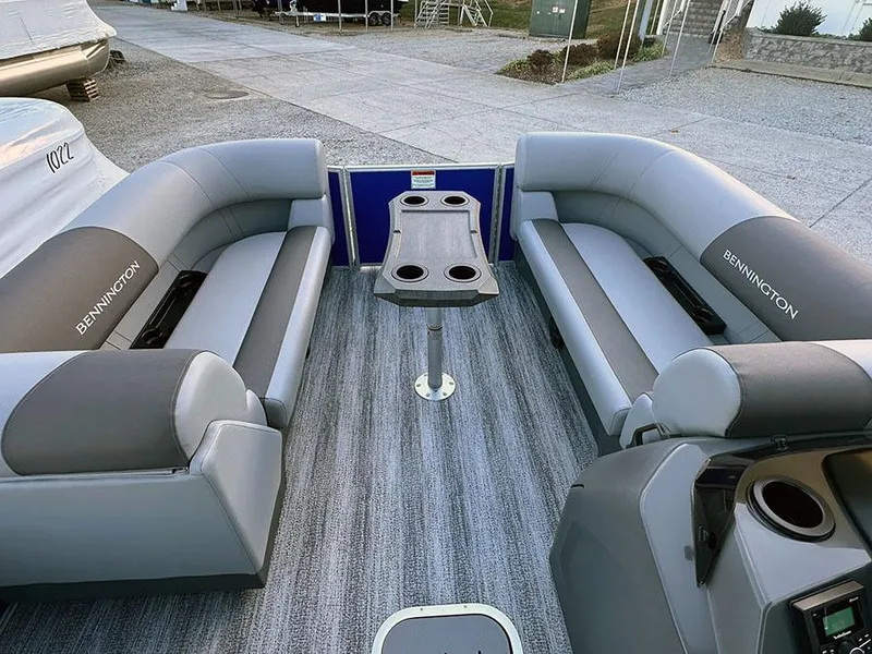 Slide: The Image of 2025 Bennington 21 S STERN RADIUS pontoon boat interior with gray seating and table. - 4