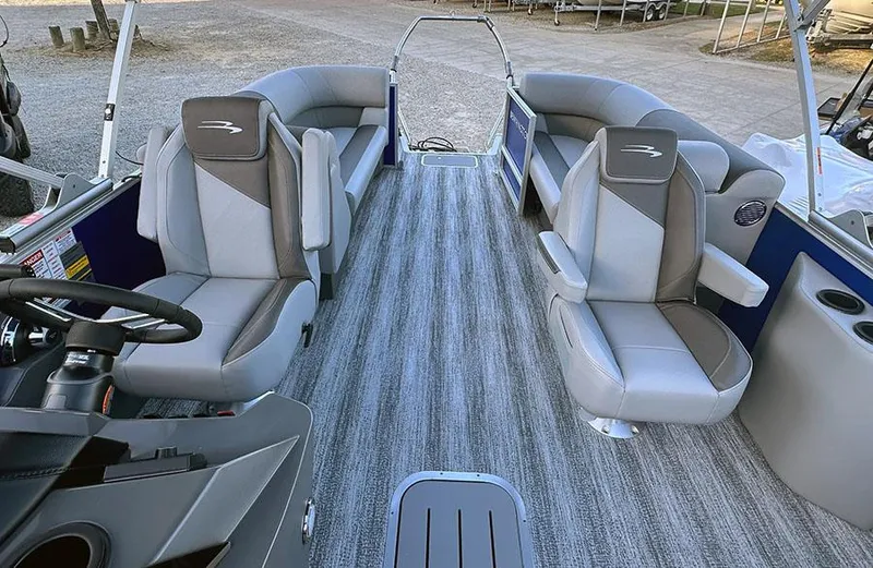 Slide: The Image of 2025 Bennington 21 S STERN RADIUS pontoon boat interior with gray seating and striped flooring. - 8