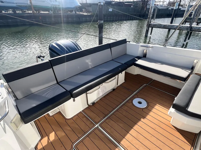 Slide: The Image of 2022 Jeanneau NC 795 S2 boat with spacious seating and teak deck. - 20