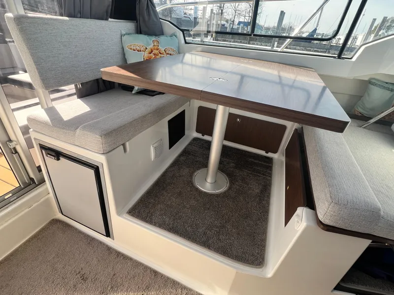 Slide: The Image of Interior of 2022 Jeanneau NC 795 S2 with seating and table setup. - 24