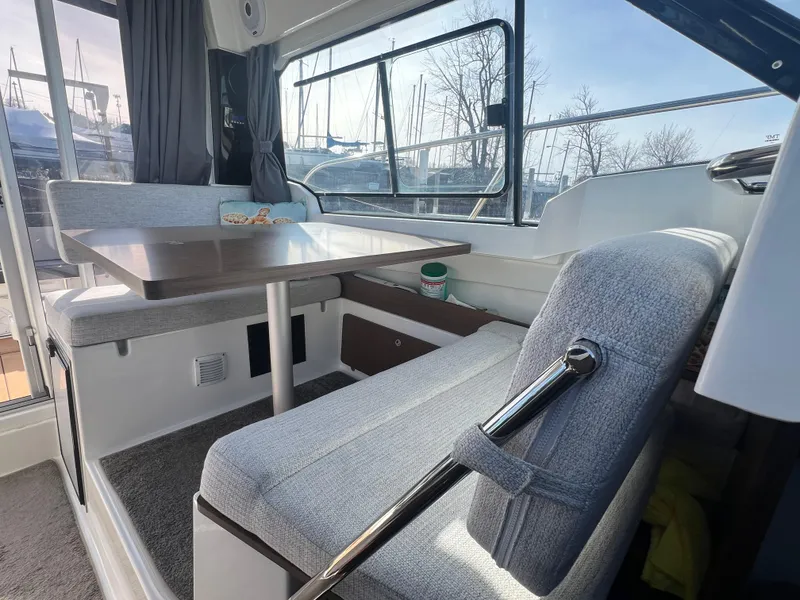 Slide: The Image of Interior of 2022 Jeanneau NC 795 S2 boat with seating and table. - 25