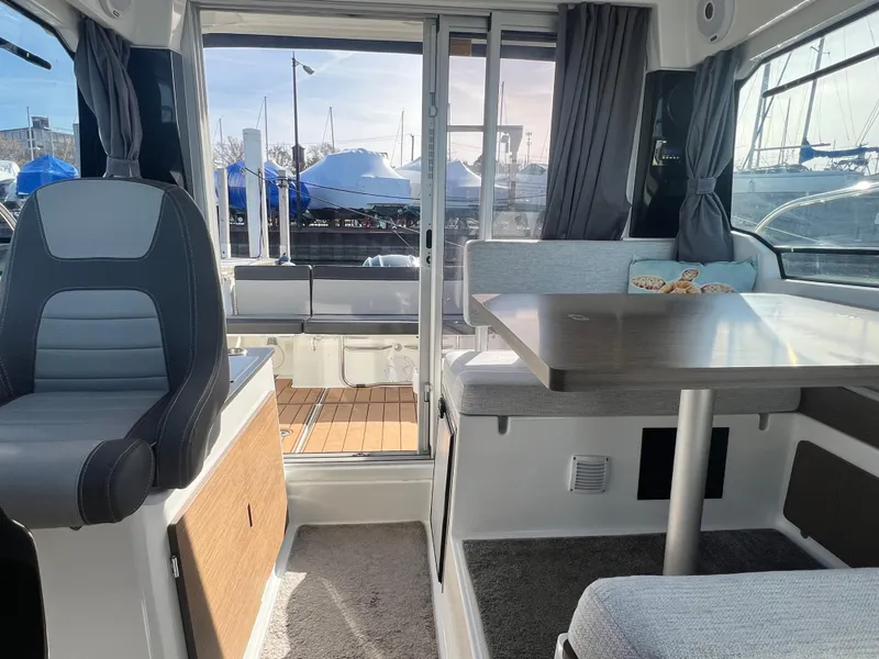 Slide: The Image of Interior of 2022 Jeanneau NC 795 S2 boat with seating and table. - 26