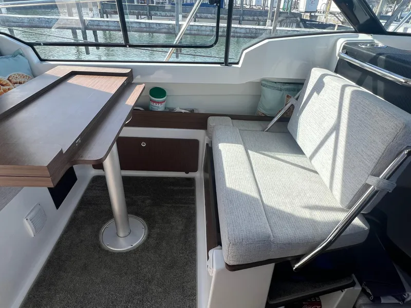 Slide: The Image of Interior of 2022 Jeanneau NC 795 S2 boat with seating and table. - 28