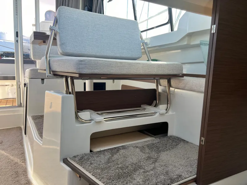 Slide: The Image of Interior of 2022 Jeanneau NC 795 S2 boat with cushioned seating and modern design. - 29