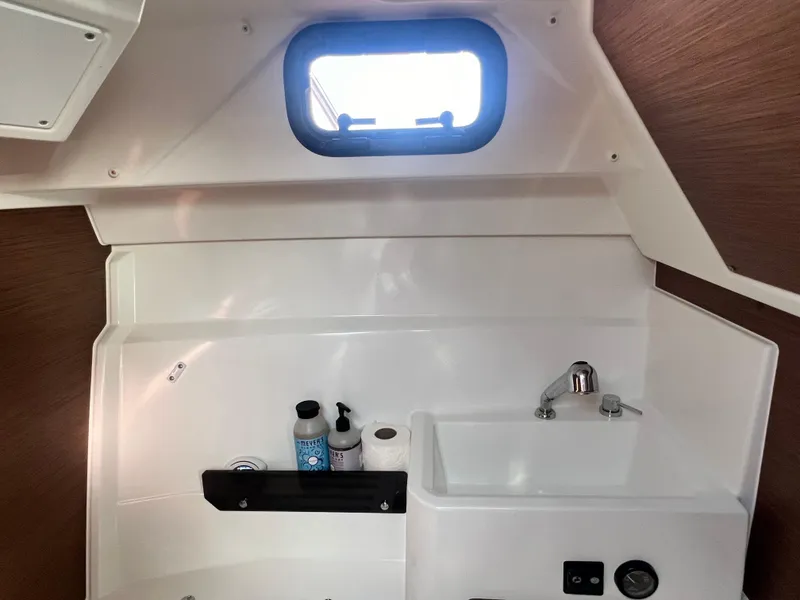 Slide: The Image of Interior of 2022 Jeanneau NC 795 S2 boat bathroom with sink and toiletries. - 35
