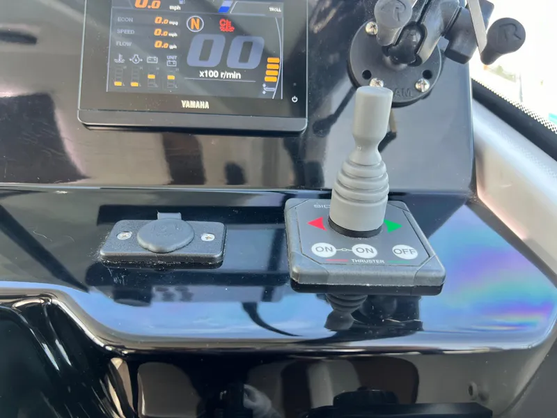 Slide: The Image of Control panel of 2022 Jeanneau NC 795 S2 boat with Yamaha display and thruster joystick. - 44