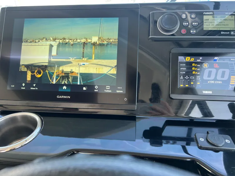 Slide: The Image of Dashboard of 2022 Jeanneau NC 795 S2 with Garmin and Yamaha displays. - 46