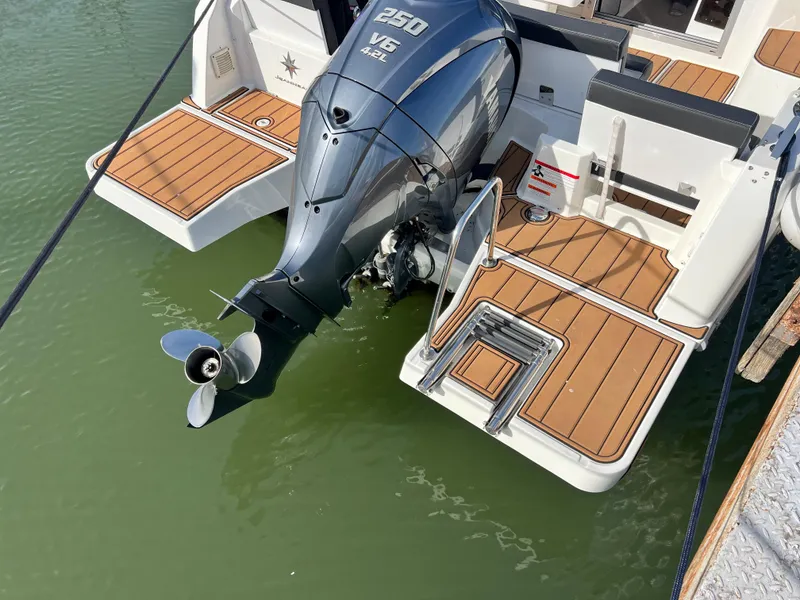 Slide: The Image of 2022 Jeanneau NC 795 S2 boat with Yamaha 250 V6 engine, docked on water. - 49