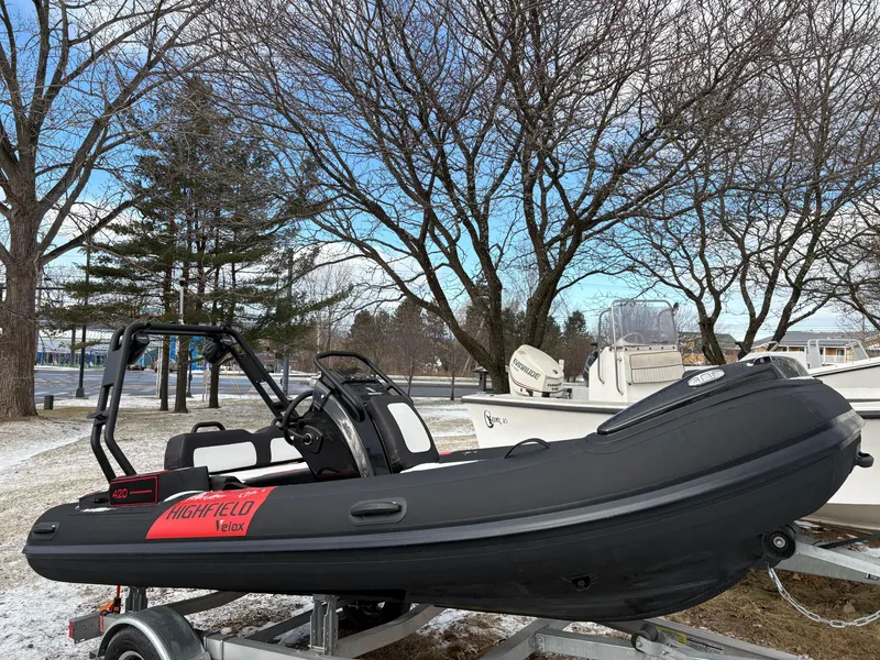 The Image of 2025 Highfield Velox 420 inflatable boat on trailer, parked outdoors in winter setting. - 0