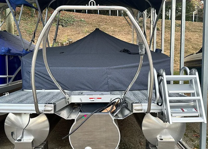 Slide: The Image of 2025 Bennington 22 S Swingback pontoon boat with cover, docked and ready for adventure. - 2