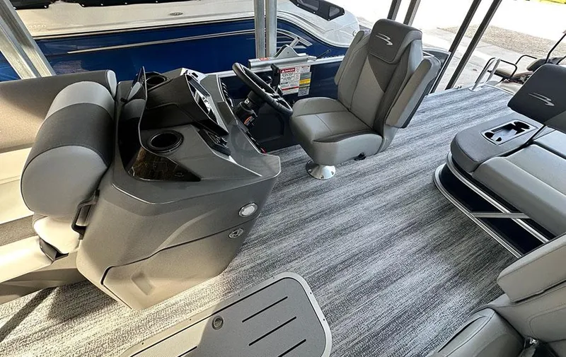 Slide: The Image of Interior of 2025 Bennington 22 S Swingback boat with modern seating and steering console. - 8