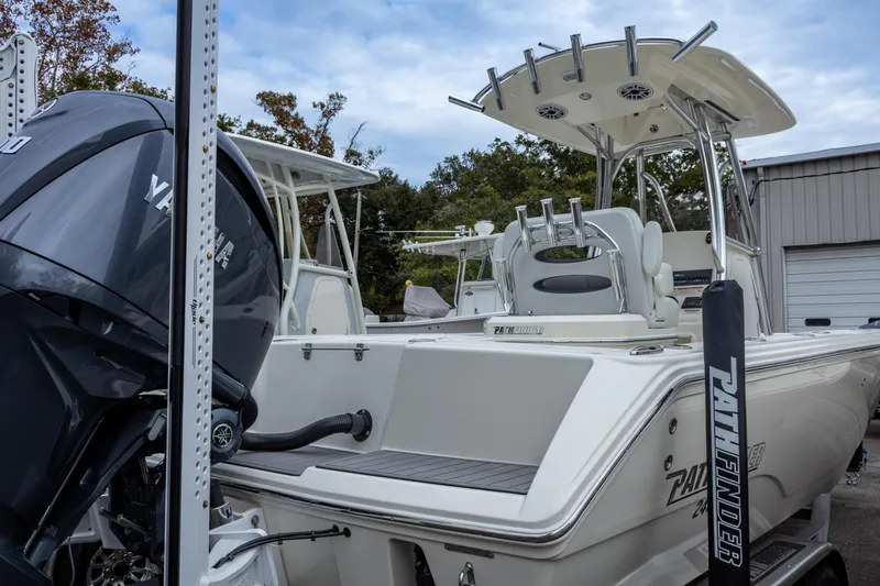 Slide: The Image of 2025 Pathfinder 2400 Open boat with Yamaha engine, docked outdoors. - 14