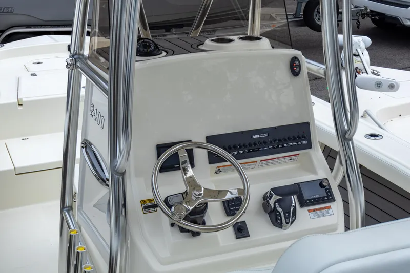Slide: The Image of 2025 Pathfinder 2400 Open boat console with steering wheel and controls. - 15