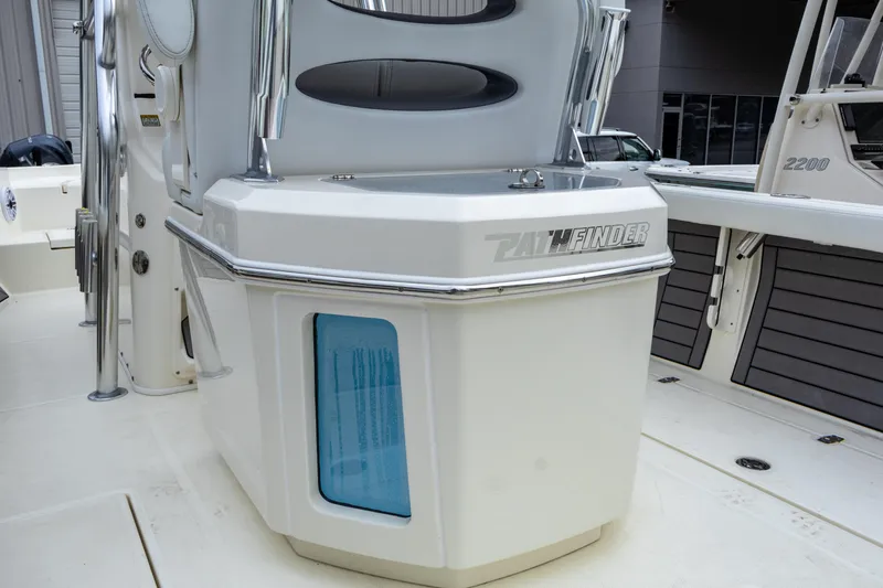 Slide: The Image of 2025 Pathfinder 2400 Open boat console with storage compartment and sleek design. - 16