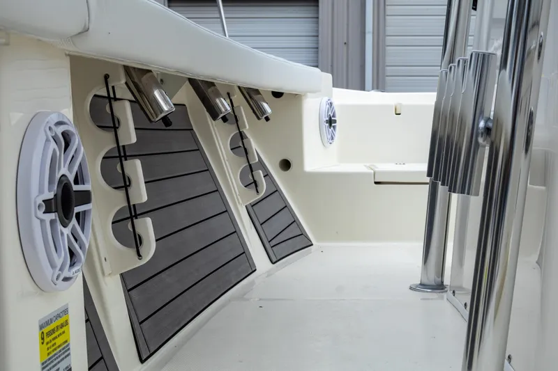 Slide: The Image of 2025 Pathfinder 2400 Open boat interior with rod holders and speakers. - 17
