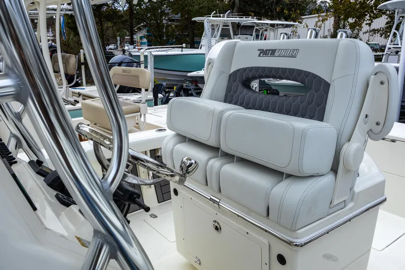 Slide: The Image of 2025 Pathfinder 2400 Open boat interior with cushioned seating and stainless steel details. - 22