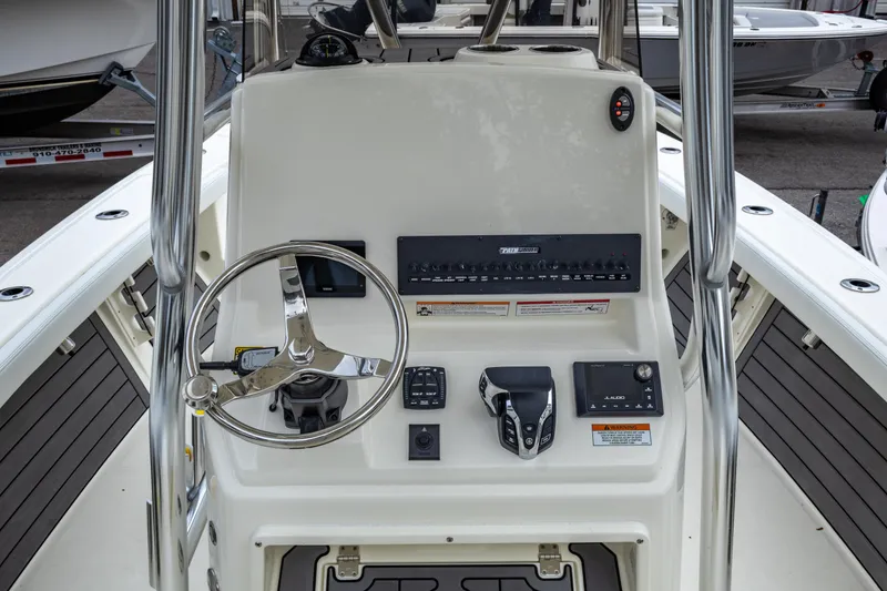 Slide: The Image of 2025 Pathfinder 2400 Open boat console with steering wheel and controls. - 23