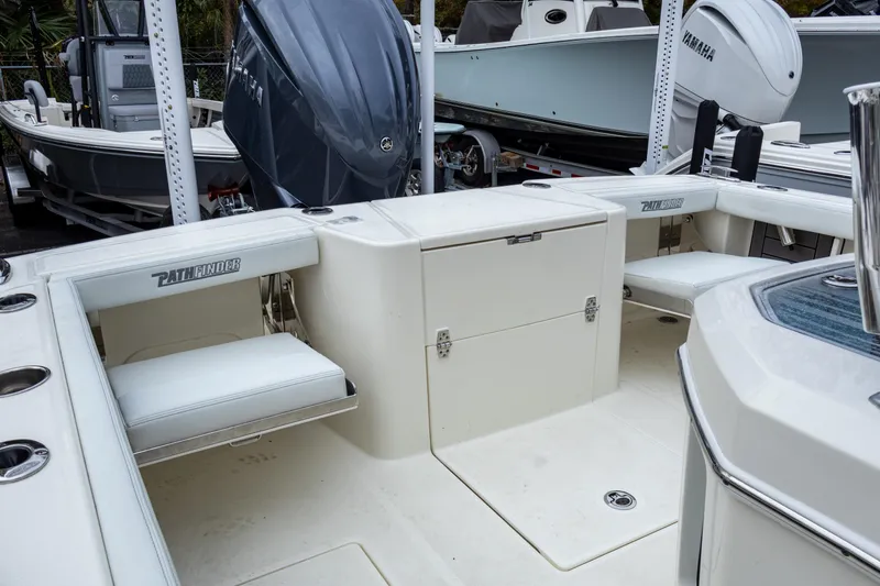Slide: The Image of 2025 Pathfinder 2400 Open boat interior with seating and storage compartments. - 25