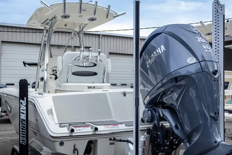 Slide: The Image of 2025 Pathfinder 2400 Open boat with Yamaha 300 V6 engine in a marina setting. - 8