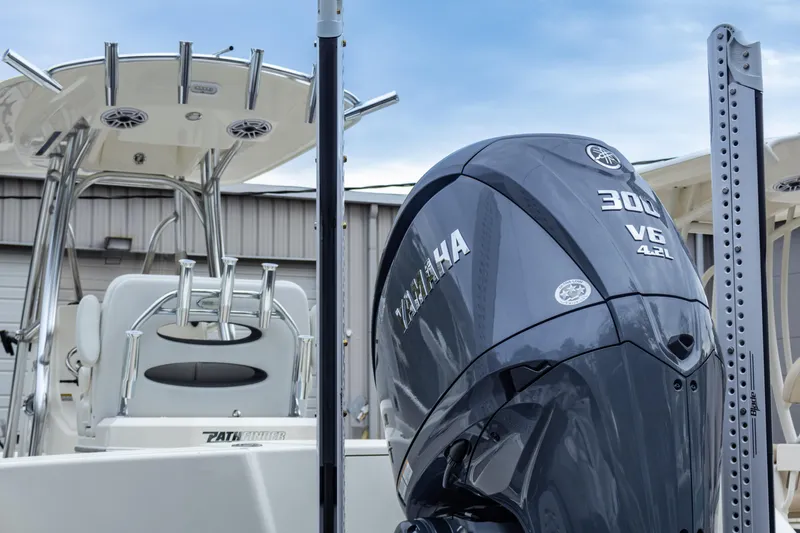 Slide: The Image of 2025 Pathfinder 2400 Open boat with Yamaha 300 V6 engine, docked under a clear sky. - 9