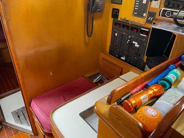 Slide: The Image of Navigation station of 1984 Farr 44 Custom yacht with control panels and equipment. - 16