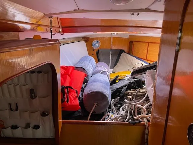 Slide: The Image of Interior of 1984 Farr 44 Custom sailboat with ropes and equipment stored. - 7