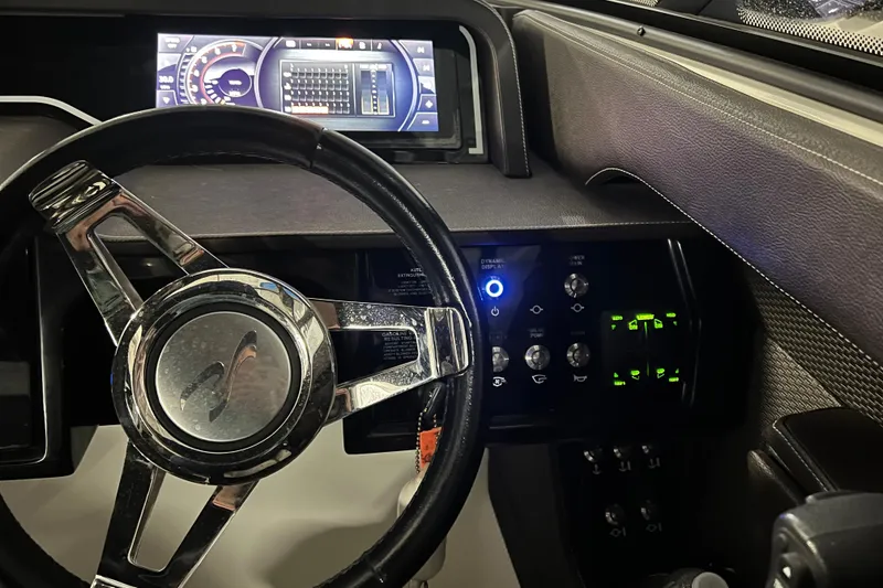 Slide: The Image of Steering wheel and dashboard of 2017 Sea Ray 280 SLX boat. - 23